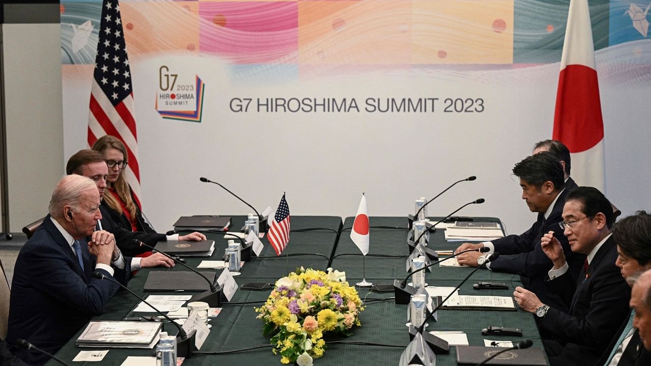 US President Joe Biden (L) attends a meeting with Japan's Prime Minister Fumio Kishida (R) in Hiroshima on May 18, 2023, ahead of the G7 Leaders' Summit. Credit: AFP Photo