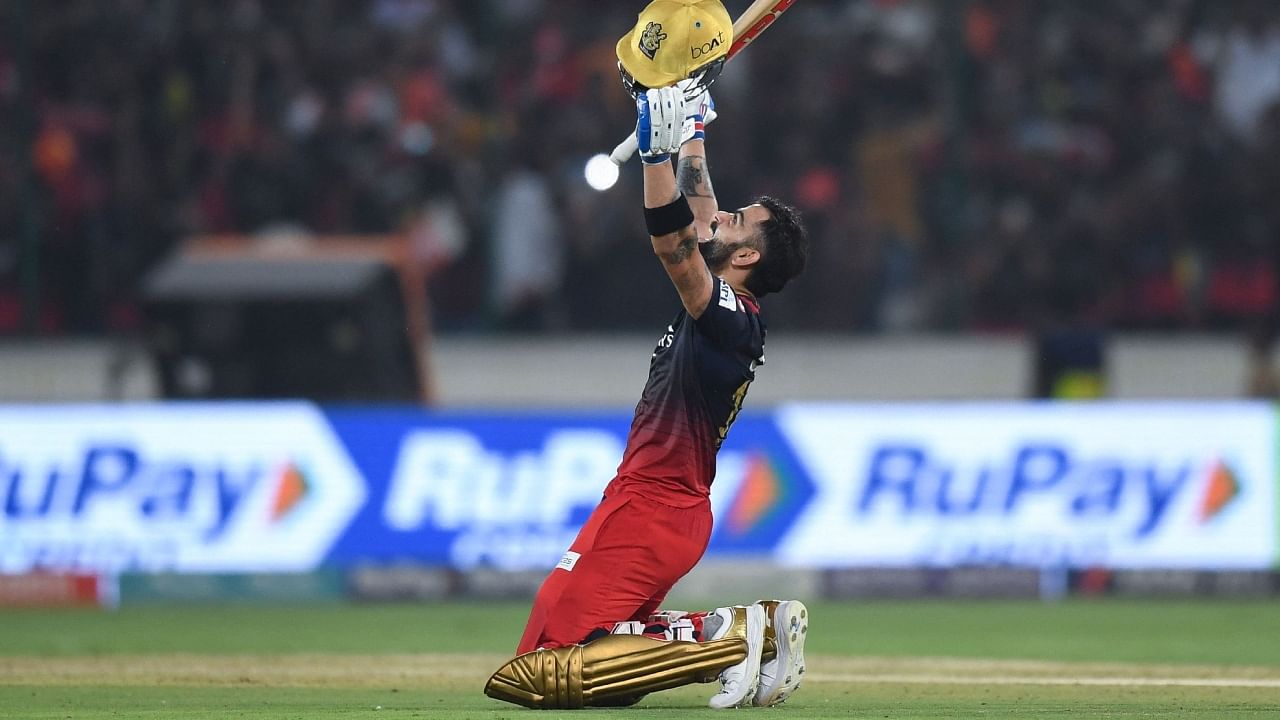 Virat Kohli celebrates scoring a 100 against SRH. Credit: AFP Photo