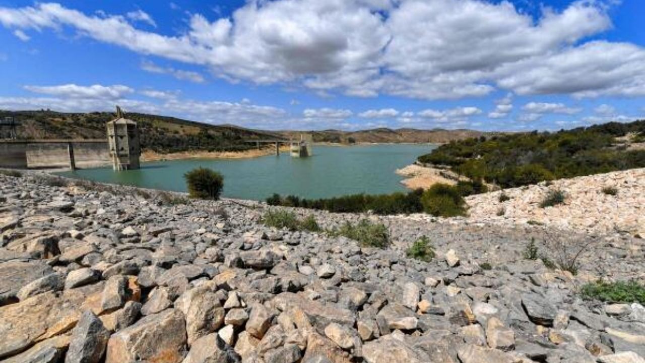 The receding reservoir waters behind the Sidi Salem dam, the largest embankment dam in Tunisia, northwest of Testour in the country's north, on April 6, 2023. Credit: AFP Photo