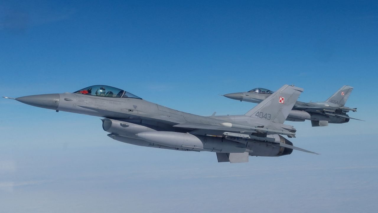 F-16 aircrafts fly during a NATO media event at an airbase in Malbork, Poland, March 21, 2023. Credit: Reuters File Photo