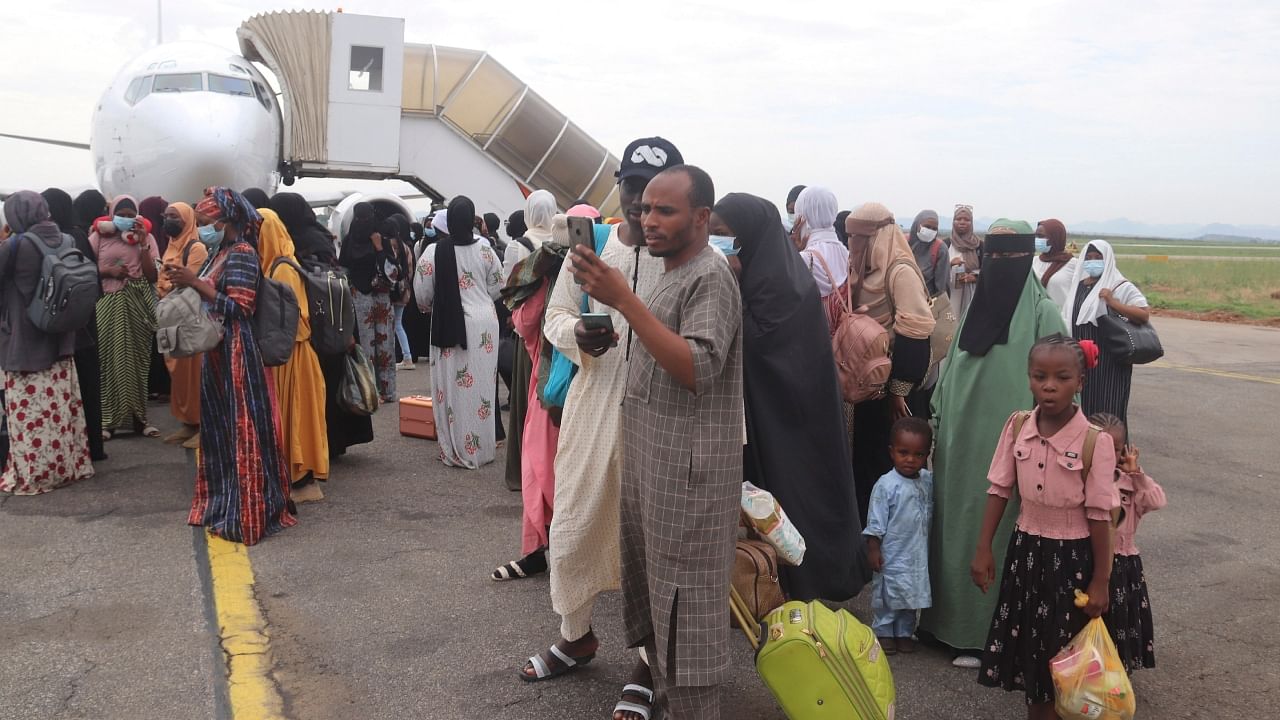 Nigerians who were evacuated from Sudan arrive at the Nnamdi Azikiwe International Airport in Abuja, Nigeria, Friday, May 5, 2023. Many Africans escaping the conflict in Sudan that erupted with little warning last month faced a long wait - three weeks for some - to get out and severe challenges on the way as their governments struggled to mobilize resources. Credit: AP/PTI Photo