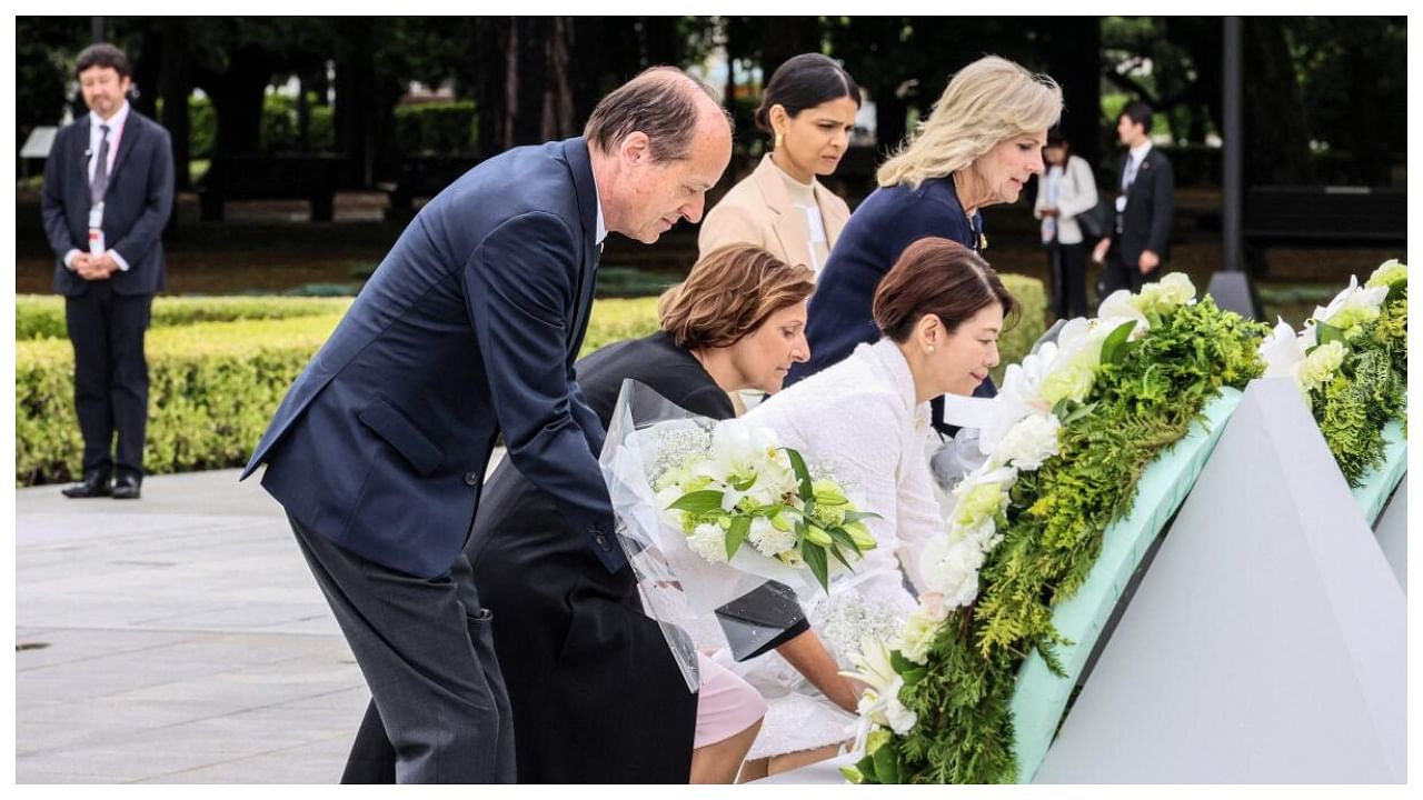 The photo shows (L to R) Heiko von der Leyen, husband of European Commission President Ursula von der Leyen, Britta Ernst, wife of German Chancellor Olaf Scholz, Japan’s First Lady Yuko Kishida, US First Lady Jill Biden and Akshata Murty, wife of British Prime Minister Rishi Sunak, during a wreath laying ceremony at the Cenotaph for Atomic Bomb Victims in the Peace Memorial Park as part of the G7 Leaders' Summit in Hiroshima on May 19, 2023. Credit: AFP Photo