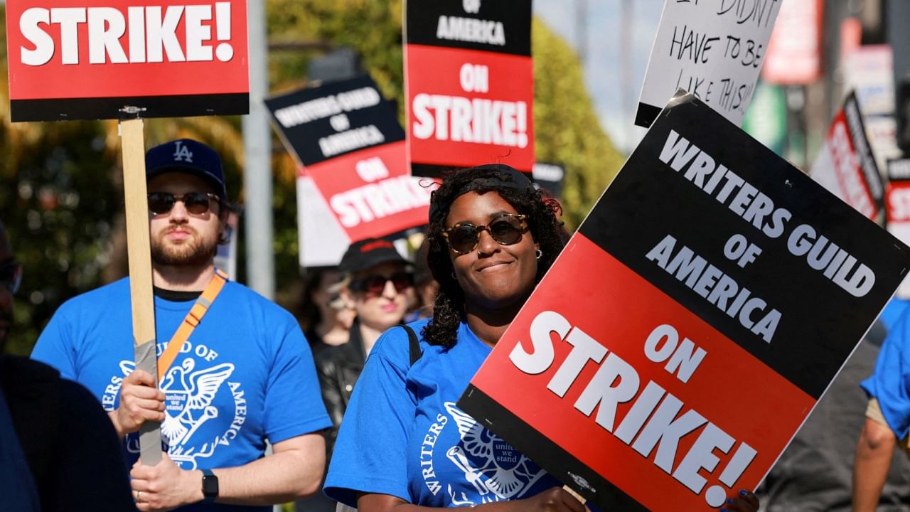 Workers and supporters of the Writers Guild of America protest at a picket line outside Paramount Studios after union negotiators called a strike for film and television writers in Los Angeles. Credit: Reuters Photo