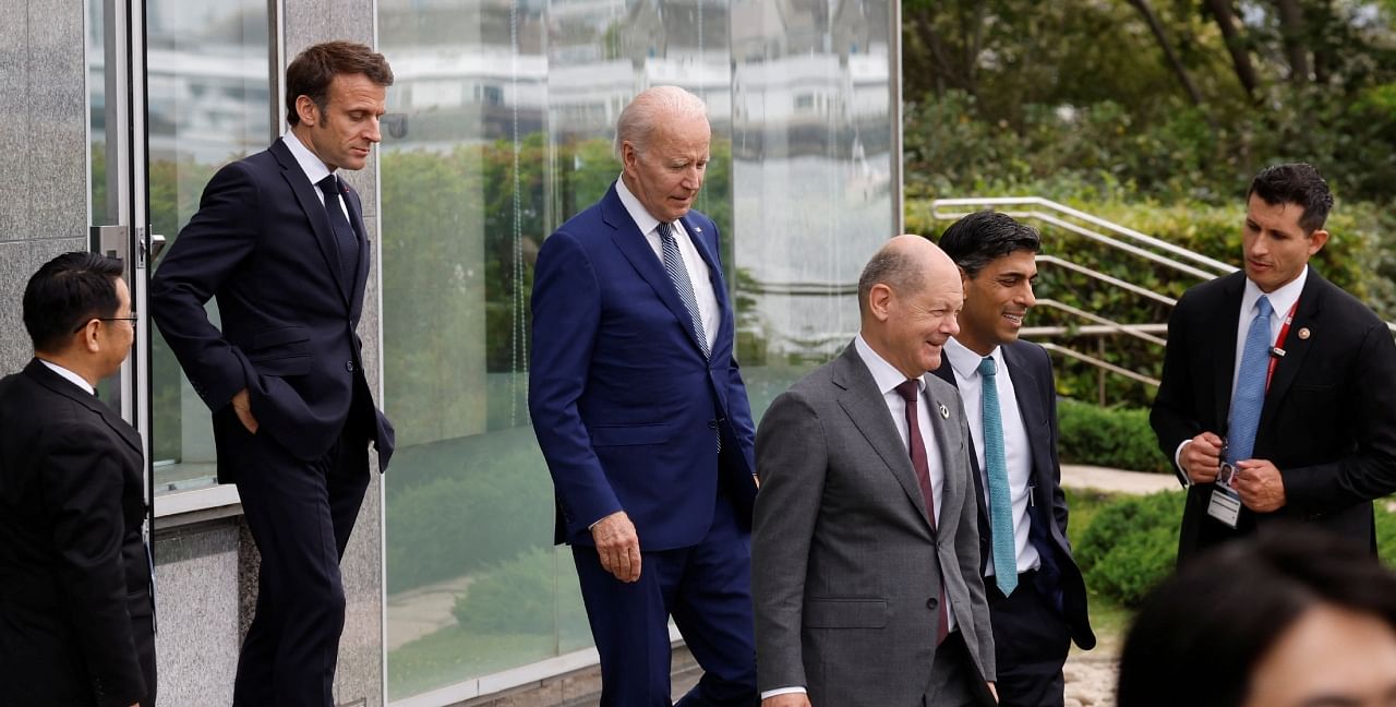 US President Joe Biden, France's President Emmanuel Macron, German Chancellor Olaf Scholz and British Prime Minister Rishi Sunak walk to participate in a family photo with G7 leaders before their working lunch meeting on economic security during the G7 summit. Credit: Reuters Photo