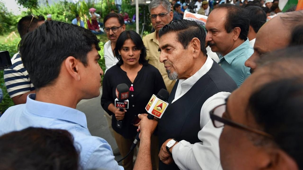 Congress leader Jagdish Tytler talks to media during party president Rahul Gandhi's nationwide daylong fast against caste violence, communalism and the non-functioning of Parliament at Rajghat, in New Delhi, in April. Credit: PTI Photo