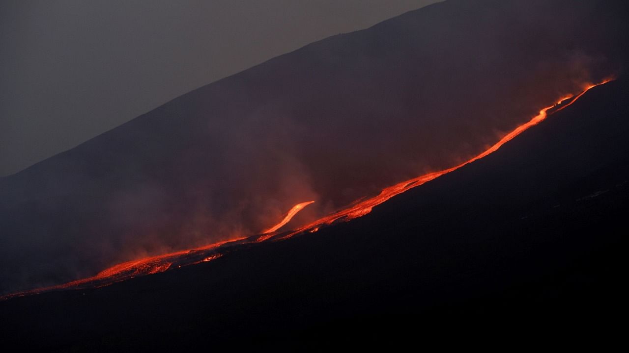 Lava flows downhill as Mount Etna erupts, as seen from Pizzi Deneri on the north side of volcano, on the island of Sicily, in Catania, Italy, May 31, 2022. Credit: Reuters File Photo