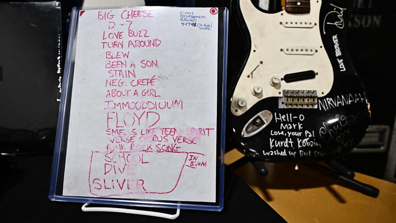 US musician Kurt Cobain's smashed Fender Stratocaster is displayed beside the 1991 'Smells Like Teen Spirit' debut performance set list at Julien's Auctions in Gardena, California on May 2, 2023. Credit: AFP Photo