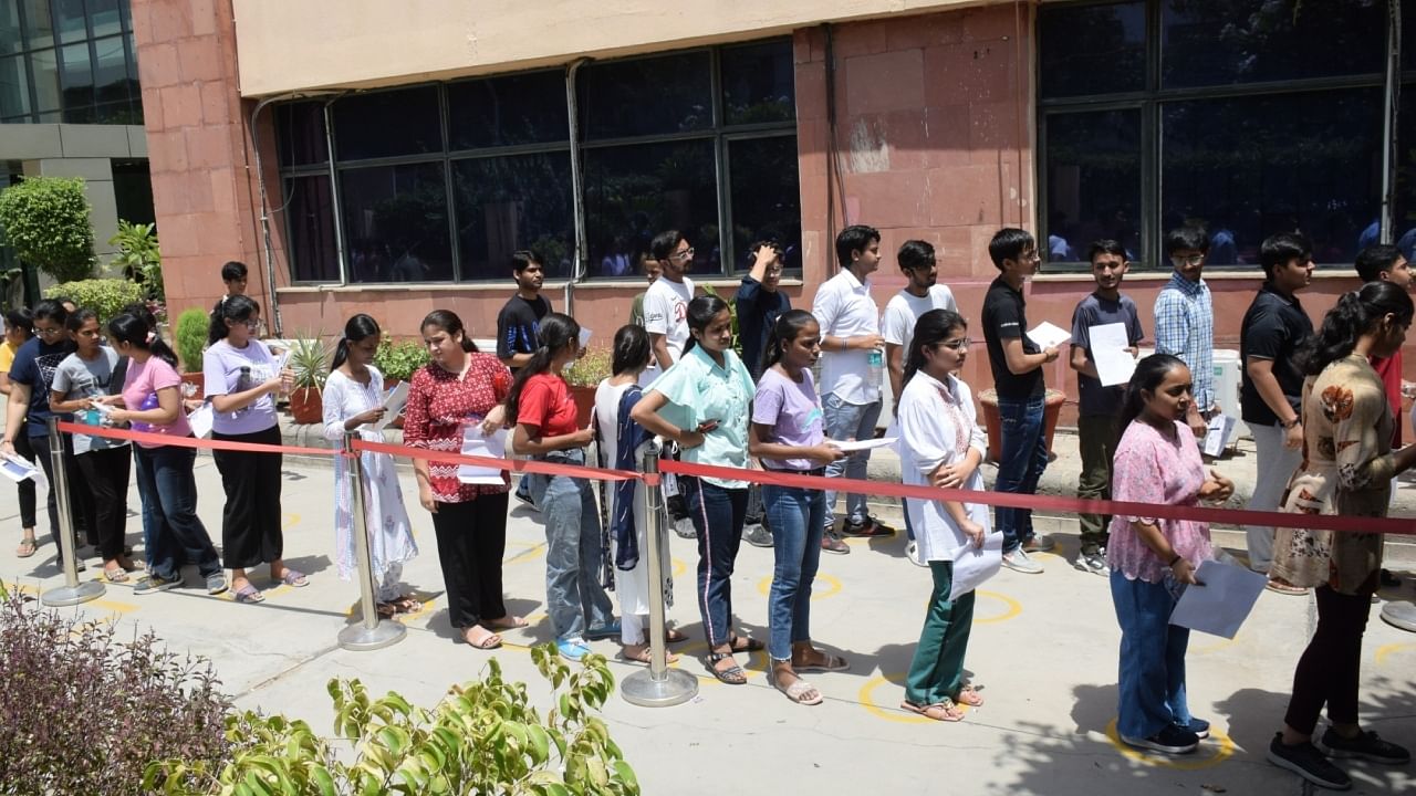 Students wait in a queue to appear in Common University Entrance Test (CUET). Credit: IANS Photo