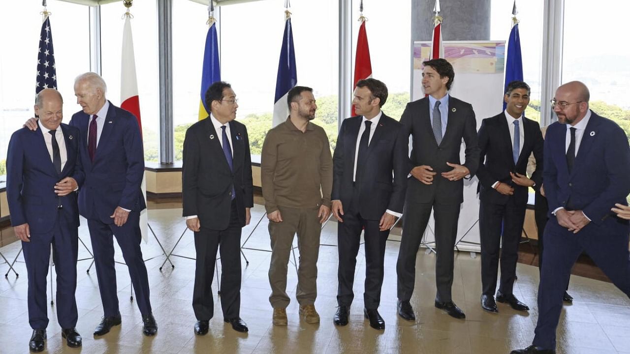 Ukrainian President Volodymyr Zelenskyy, fourth left, and G7 leaders pose for a photo. Credit: AP/PTI Photo