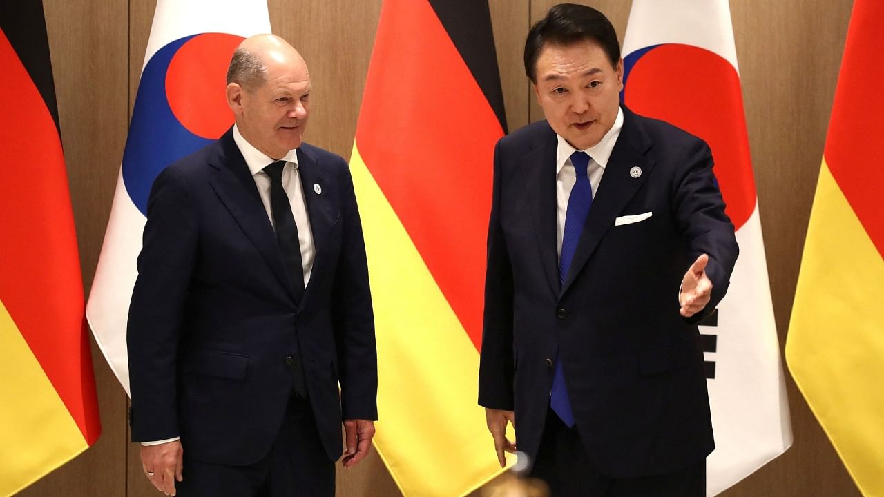 German Chancellor Olaf Scholz and South Korea's President Yoon Suk Yeol arrive for a meeting at the Presidential Office in Seoul, South Korea. Credit: Reuters Photo
