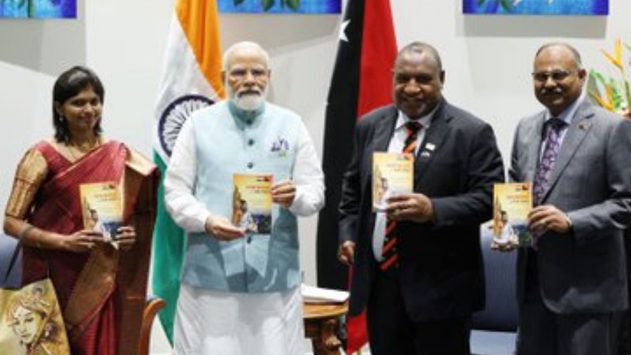 PM Modi releasing the Thirukkural in Tok Pisin language. Credit: Twitter/ @narendramodi