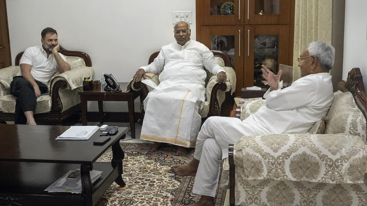 Bihar Chief Minister Nitish Kumar interacts with Congress President Mallikarjun Kharge and Congress leader Rahul Gandhi. Credit: PTI Photo