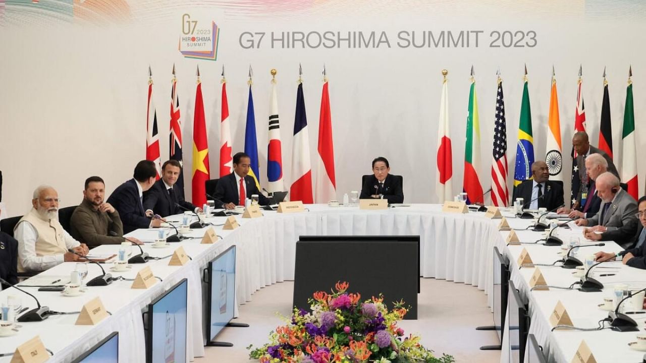 Japan's Prime Minister Fumio Kishida (C) chairs the the "G7 + Partner Countries + Ukraine" meeting on the sidelines of the final day of the G7 Summit Leaders' Meeting in Hiroshima. Credit: AFP Photo