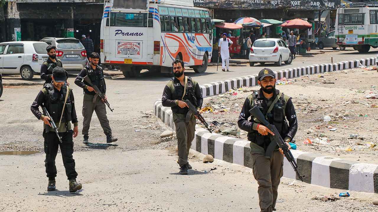 Jammu: Crisis Response Team (CRT) personnel patrol at a bus stand amid high alert for the G20 meetings. Credit: PTI Photo