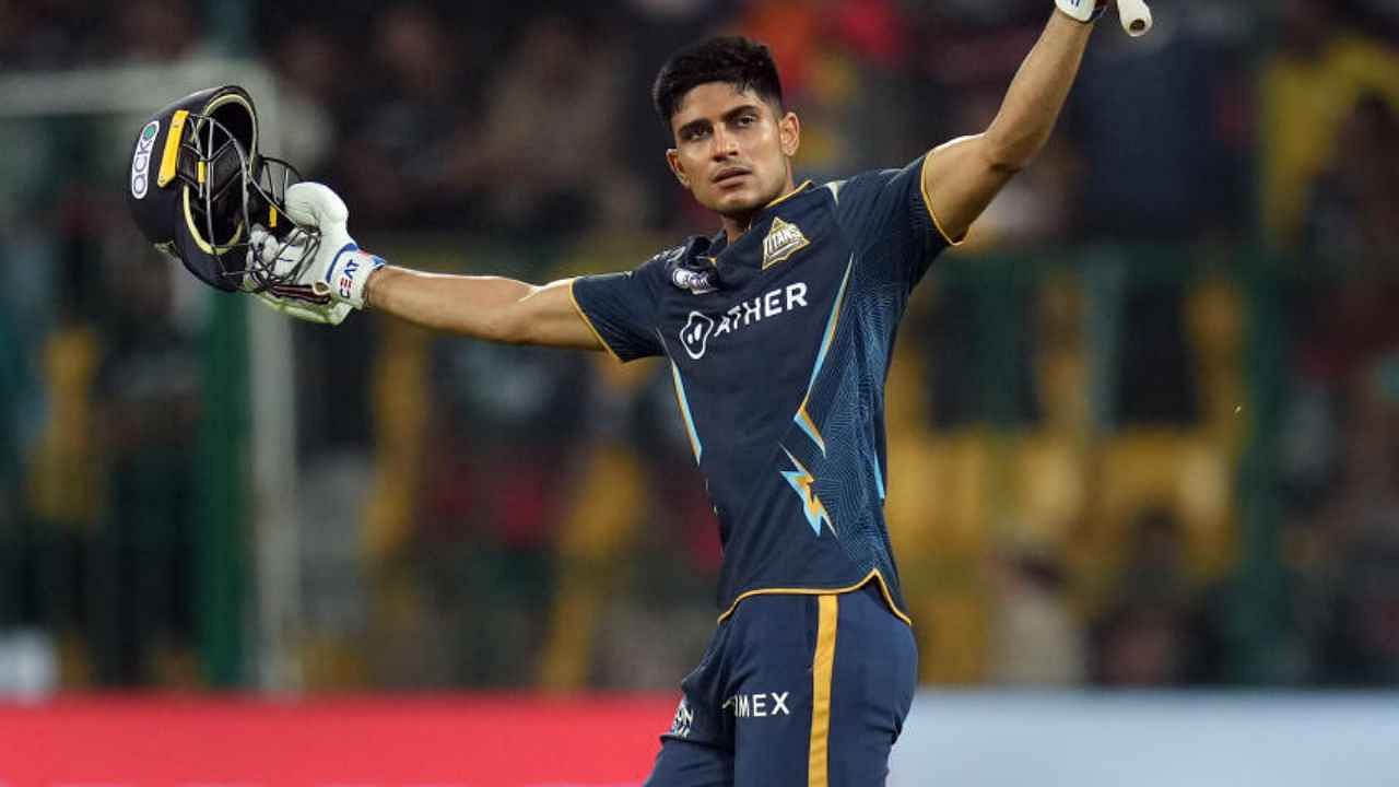 Gujarat Titans batter Shubman Gill celebrates after his century and victory in the IPL 2023 cricket match against Royal Challengers Bangalore. Credit: PTI Photo