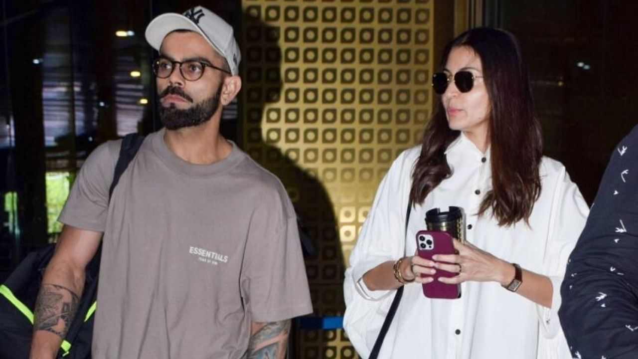 Virat Kohli with his wife and actress Anushka Sharma arrive at the airport in Mumbai on Monday, May 22. Credit: IANS Photo