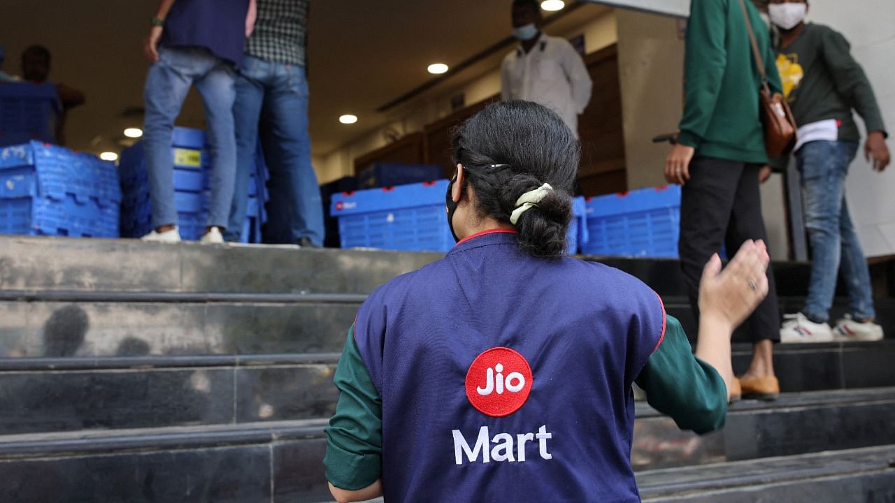 A woman wearing a Reliance JioMart vest. Credit: Reuters Photo