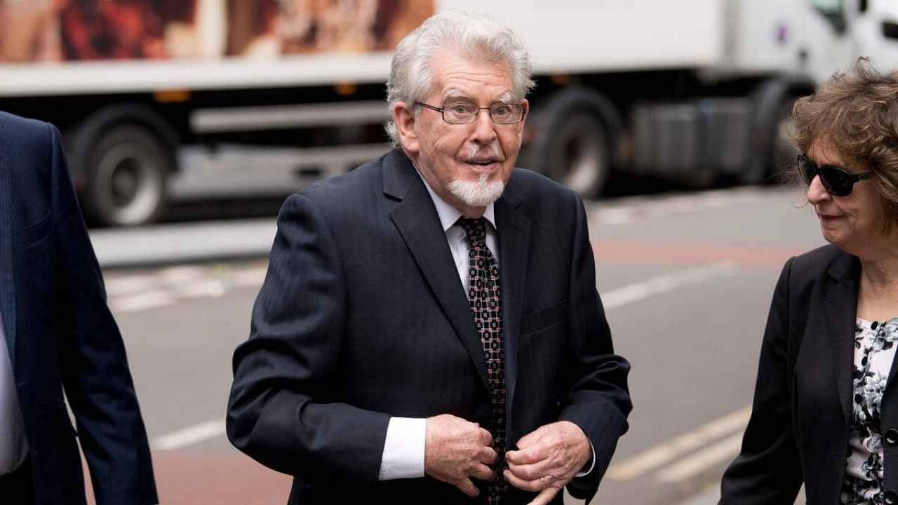Australian entertainer Rolf Harris arrives at Southwark Crown Court in London on May 22, 2017 for a court hearing accused of four counts of indecent assault. Artist, presenter and musician Rolf Harris, who was one of the UK's best-loved entertainers before he was convicted of underage-sex crimes in 2014, has died aged 93 and been buried, his family said on May 23, 2023. Credit: AFP Photo