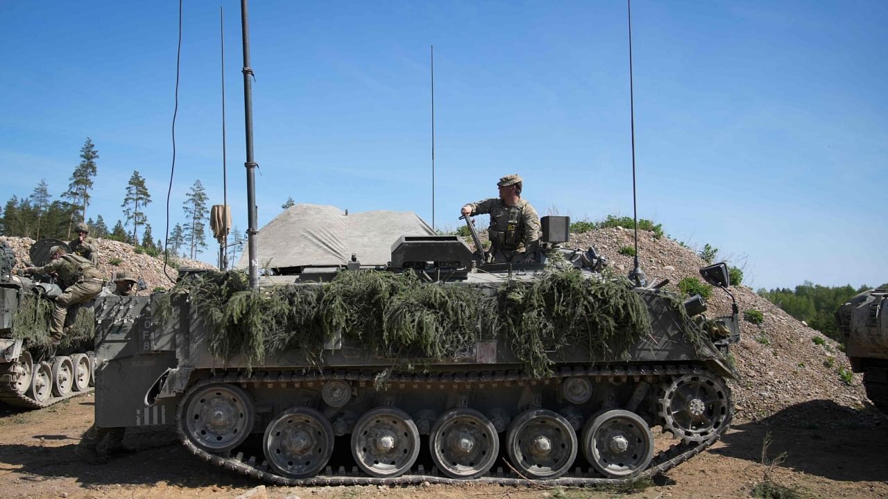 A member of the British armed forces is seen in a Bulldog armoured personnel carrier during the NATO Spring Storm exercises in Sakussaare, Estonia on May 20, 2023. Credit: AFP Photo