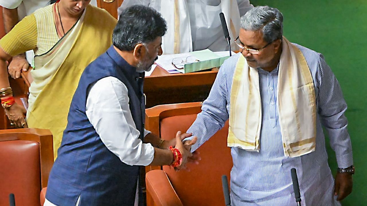 Karnataka Chief Minister Siddaramaiah and Deputy Chief Minister D K Shivakumar on the first day of the Karnataka Assembly session. Credit: PTI Photo