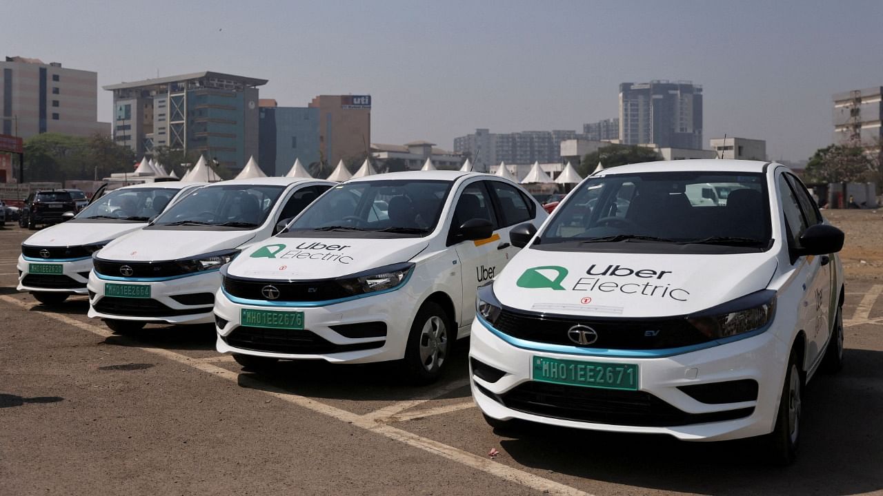 Uber electric taxis are seen outside a charging station in Mumbai. Credit: Reuters Photo