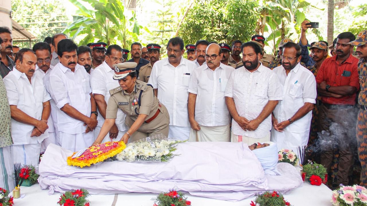 Director General of Police, Fire and Rescue Services, B. Sandhya IPS pays her respect to the fireman who was killed while attempting to douse the fire at Kinfra Park, in Thiruvananthapuram. Credit: PTI Photo