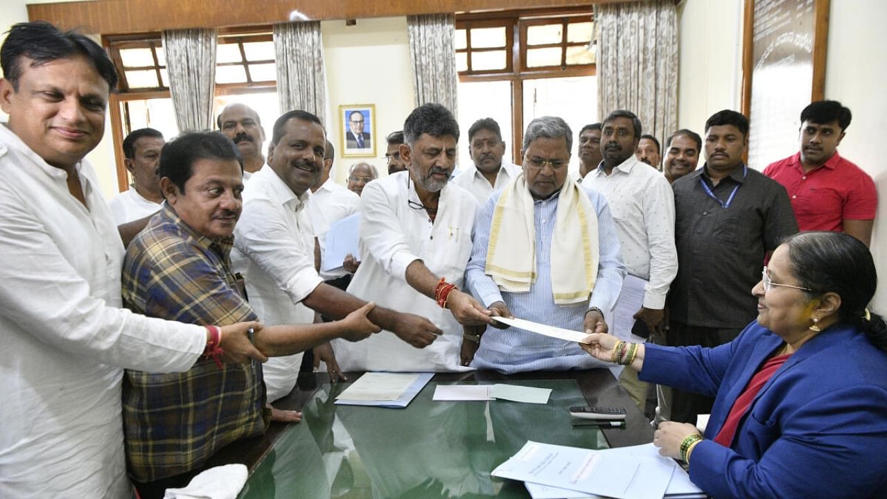 Chief Minister Siddaramaiah, his deputy D K Shivakumar, Minister Zameer Ahmed Khan and MLA Ajay Singh accompany U T Khader as he files his papers for the election of Assembly Speaker at the Vidhana Soudha on Tuesday. Credit: Special Arrangement