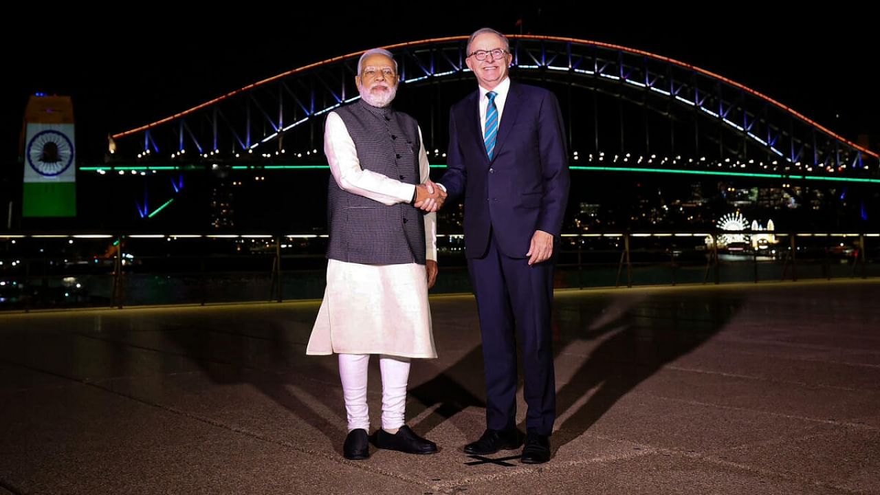 Prime Minister Narendra Modi with Australian Prime Minister Anthony Albanese at the Sydney Harbour Bridge, illuminated in Indian tricolour, in Sydney, Wednesday, May 24, 2023. Credit: PT Photo