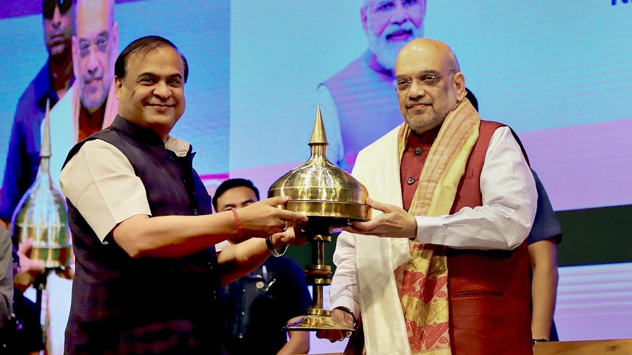 Union Minister for Home Affairs and Cooperation Amit Shah being felicitated by Assam CM Himanta Biswa Sarma at the laying foundation ceremony of National Forensic Sciences University (NFSU), in Guwahati. Credit: PTI Photo