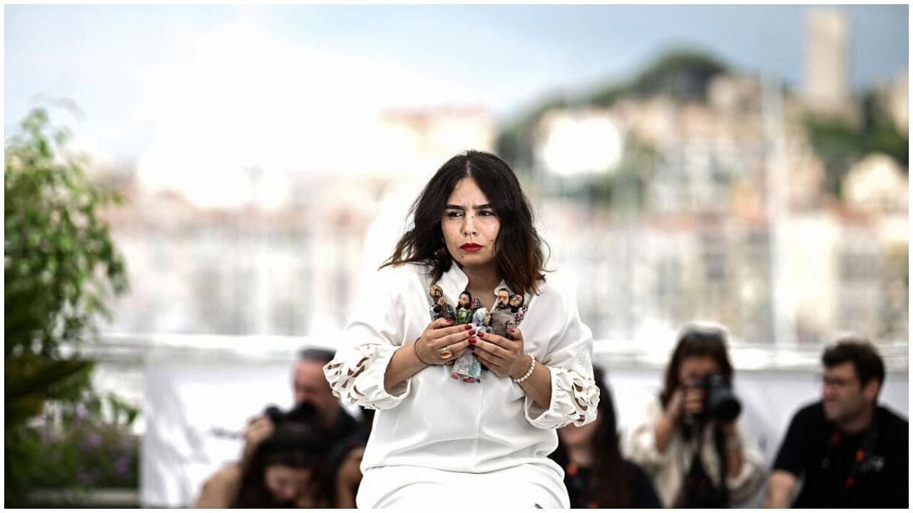 Moroccan director Asmae El Moudir poses during a photocall for the film "Kadib Abyad" (The Mother of All Lies) at the 76th edition of the Cannes Film Festival in Cannes, southern France, on May 25, 2023. Credit: AFP Photo