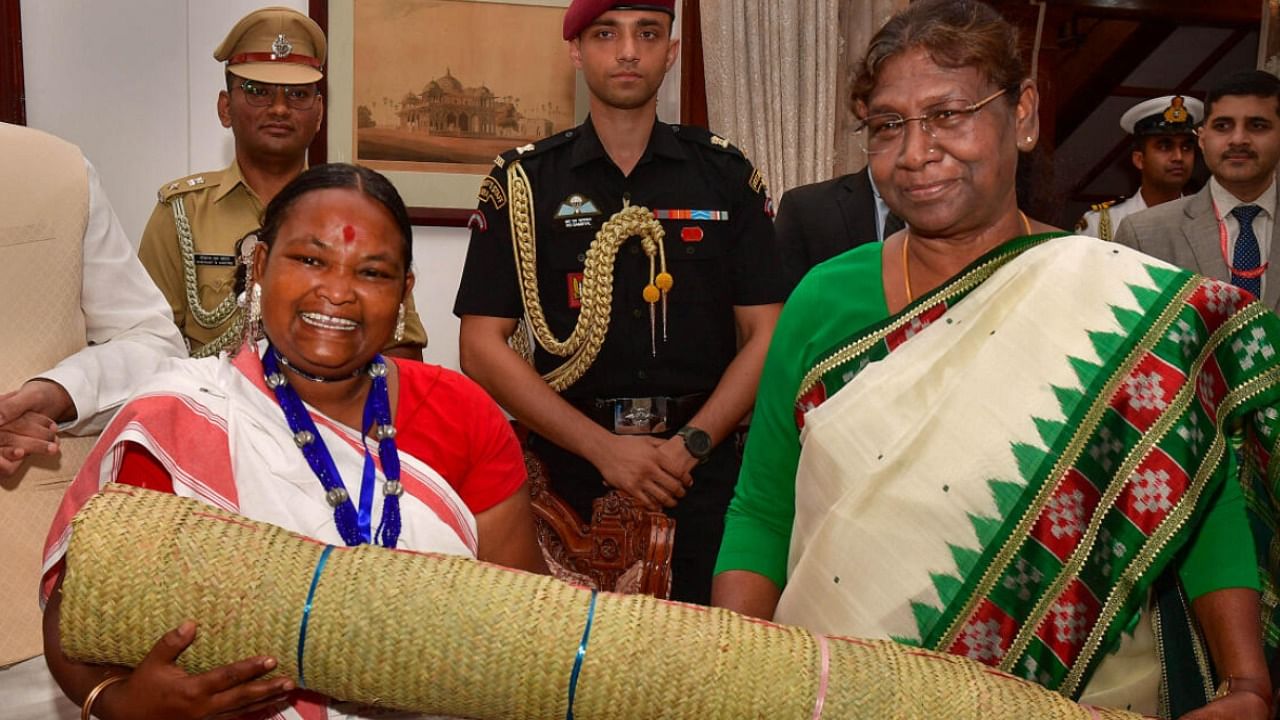 President Droupadi Murmu during her interaction with members of Particularly Vulnerable Tribal Groups (PVTGs) of Jharkhand. Credit: PTI Photo