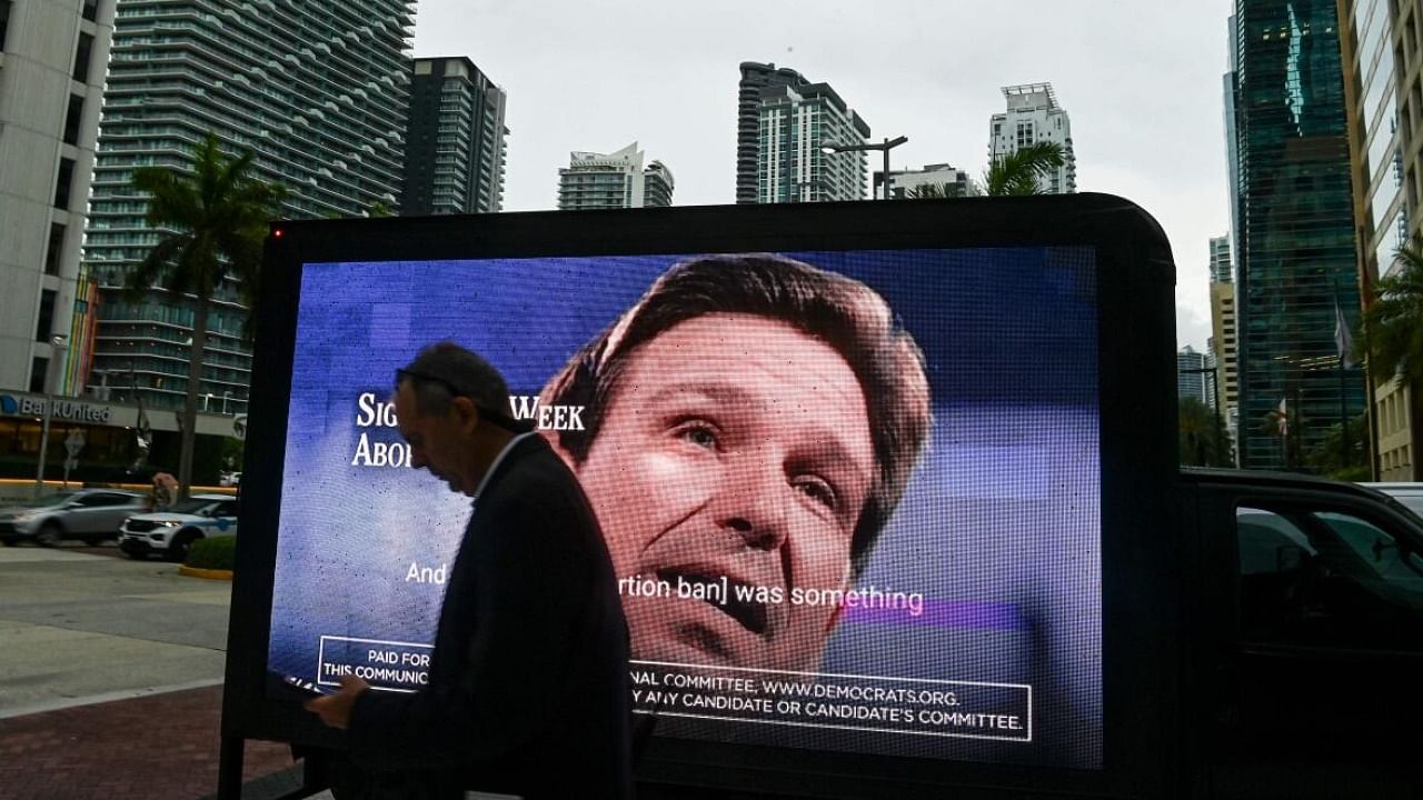 Demonstrators gather outside the Four Season Hotel in Miami as Florida Governor Ron DeSantis holds fundraising events ahead of his presidential candidacy announcement. Credit: AFP Photo