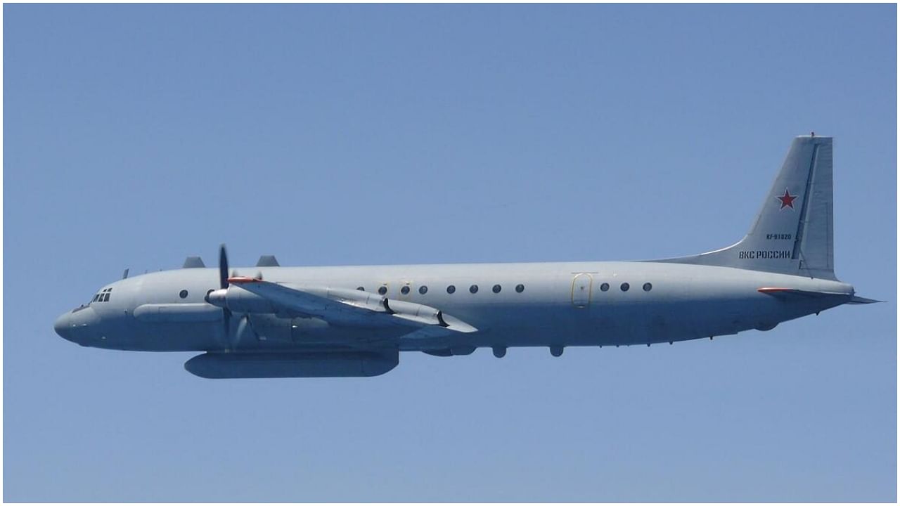 This handout photo taken and received on May 25, 2023 from Japan's Ministry of Defense shows a Russian Ilyushin IL-20 aircraft in the air off the west coast of Japan. Credit: AFP Photo/ Ministry of Defense