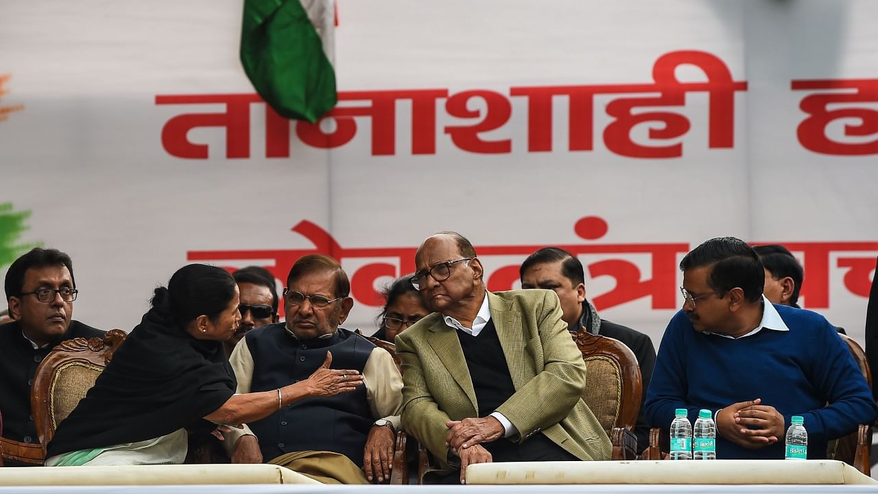 (L-R) Chief Minister of West Bengal Mamata Banerjee, former member of Rajya Sabha Sharad Yadav, president of the Nationalist Congress Party Sharad Pawar and Chief Minister of the Delhi Arvind Kejriwal attend an opposition political rally in New Delhi on February 13, 2019. Credit: AFP File Photo