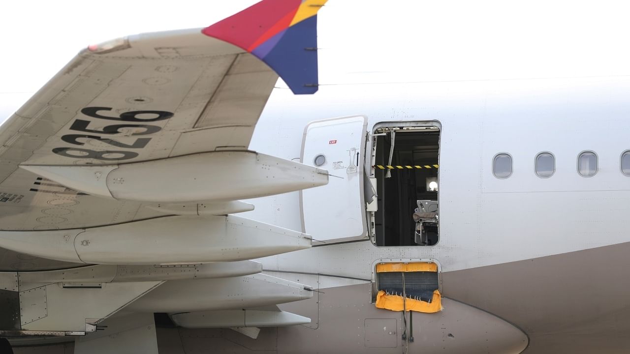 An Asiana Airlines plane is parked as one of the plane's doors suddenly opened at Daegu International Airport in Daegu, South Korea, Friday, May 26, 2023. Credit: AP/PT Photo