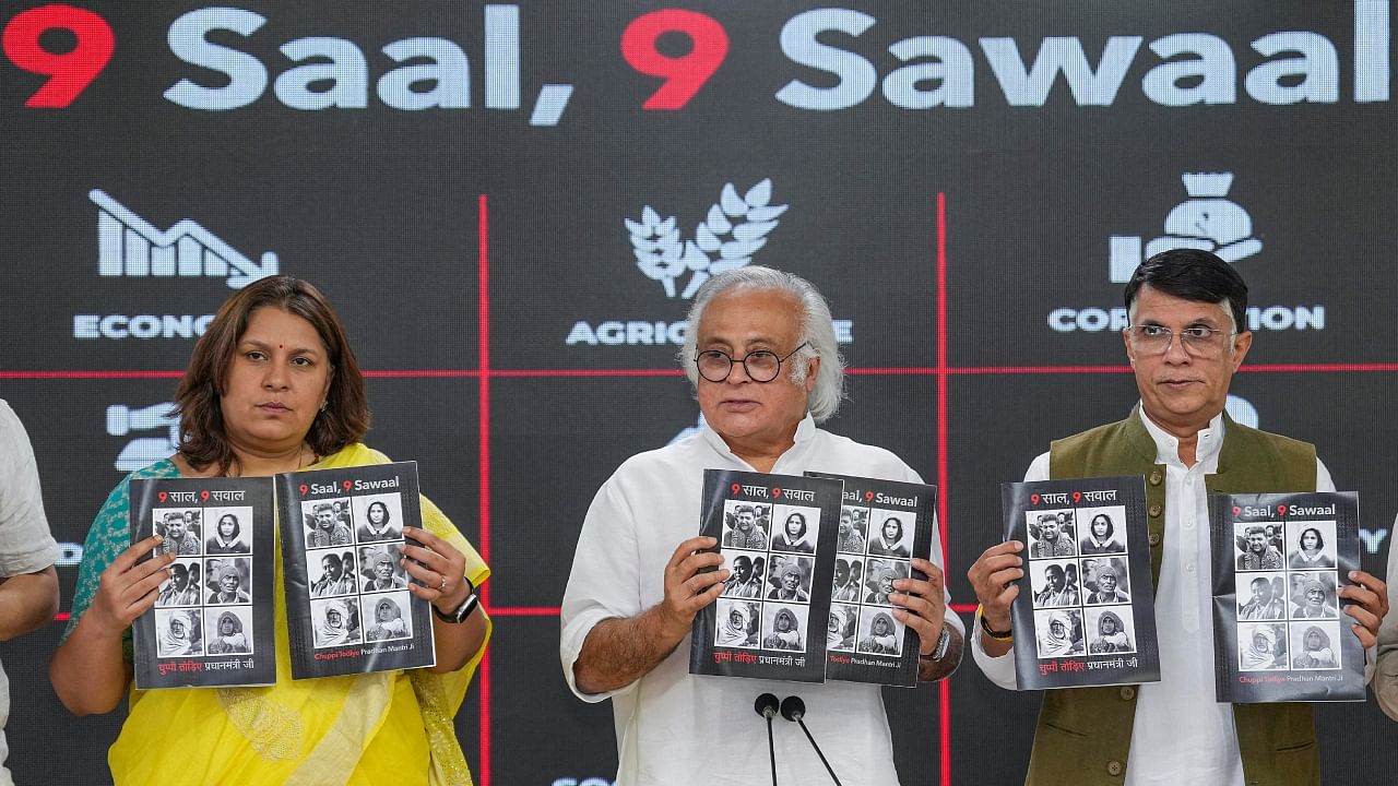 Congress party leader Jairam Ramesh with party leaders Supriya Shrinate (L) and Pawan Khera (R) and others during a press conference, in New Delhi, Friday, May 26, 2023. Credit: PTI Photo