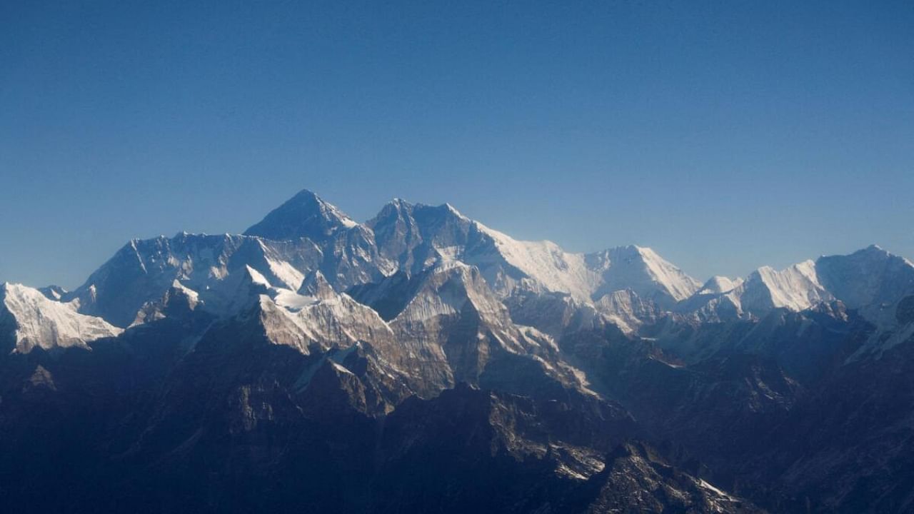 Mount Everest, the world highest peak, and other peaks of the Himalayan range are seen through an aircraft window during a mountain flight from Kathmandu, Nepal January 15, 2020. Credit: Reuters Photo