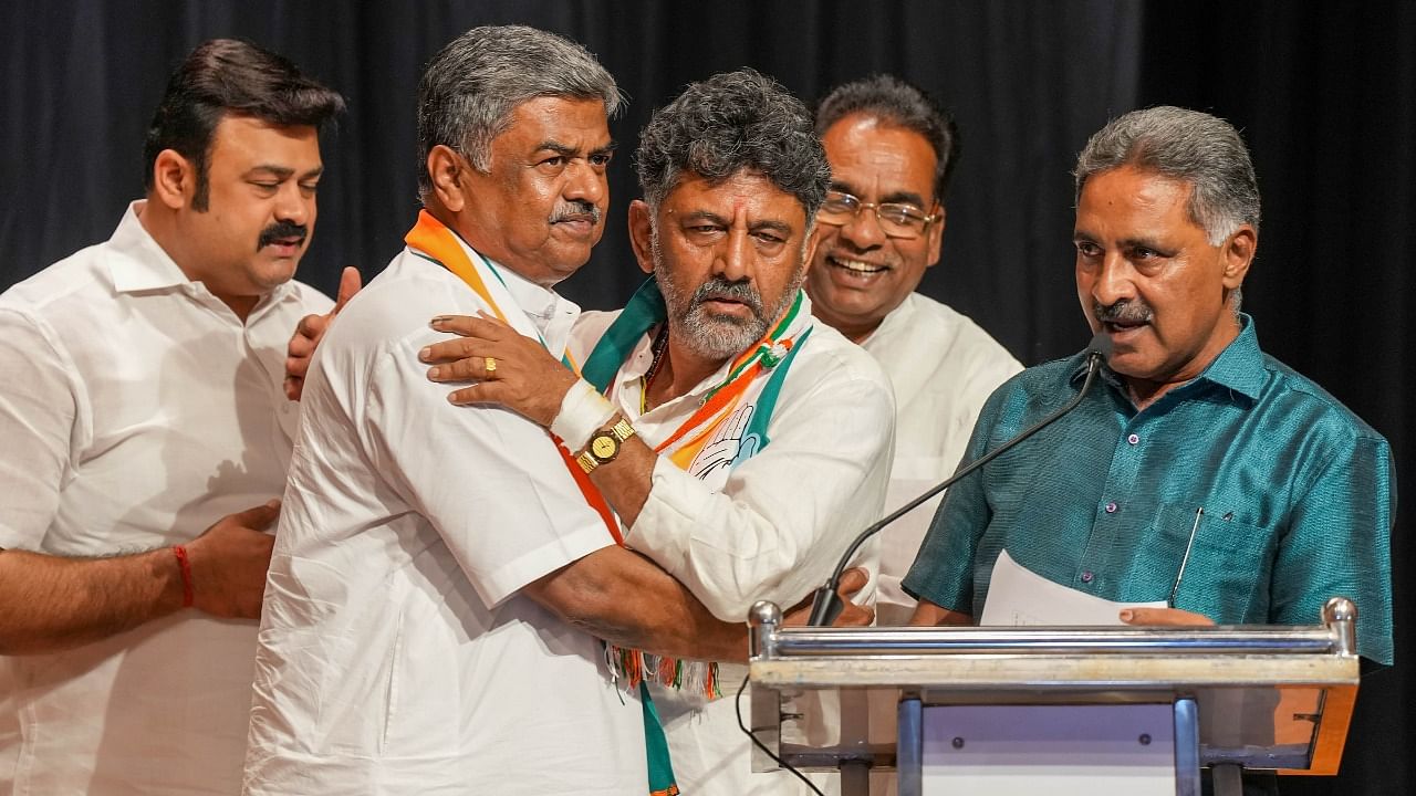 Karnataka Congress President D.K. Shivakumar with party leader B.K. Hariprasad during celebrations after the party's win in Karnataka Assembly elections. Credit: PTI Photo