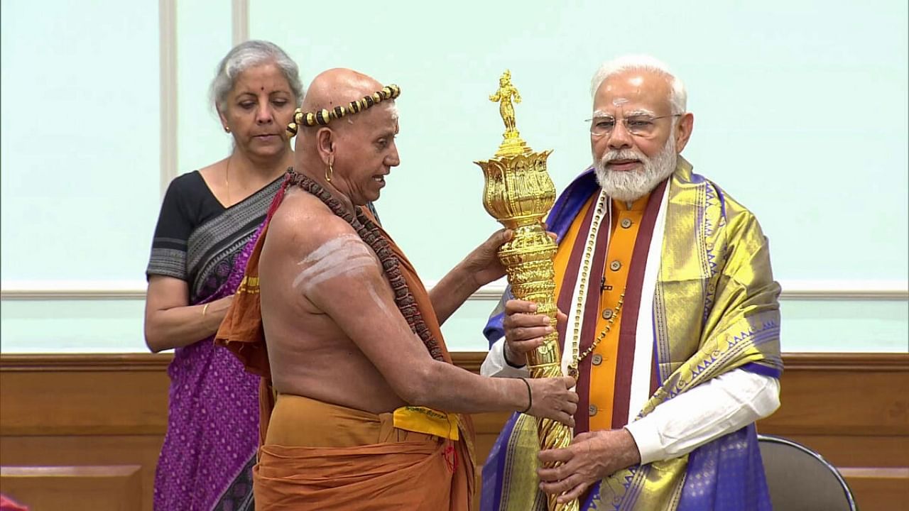 Prime Minister Narendra Modi receives 'Sengol' from an Adheenam on eve of new Parliament building inauguration. Credit: PTI Photo