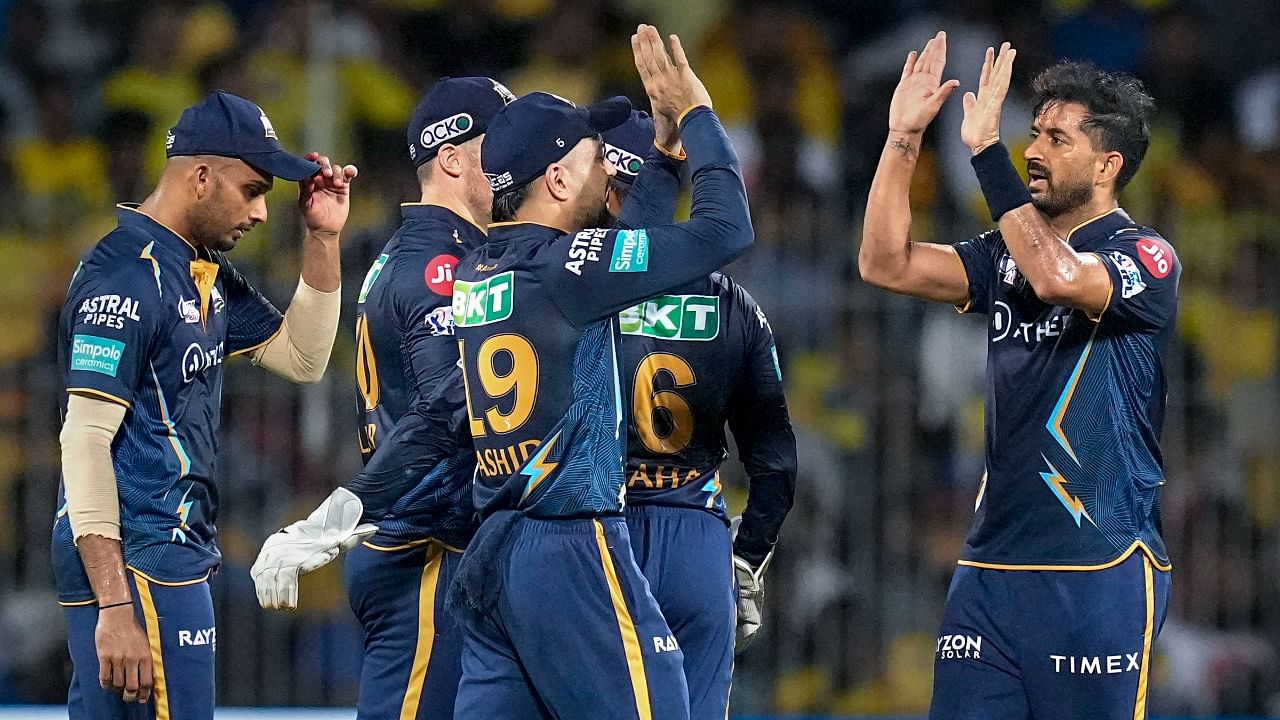 Gujarat Titans bowler Mohit Sharma celebrates with teammates the wicket of Chennai Super Kings batter Ruturaj Gaikwad during the IPL 2023 first qualifier cricket match between Chennai Super Kings and Gujarat Titans. Credit: PTI Photo