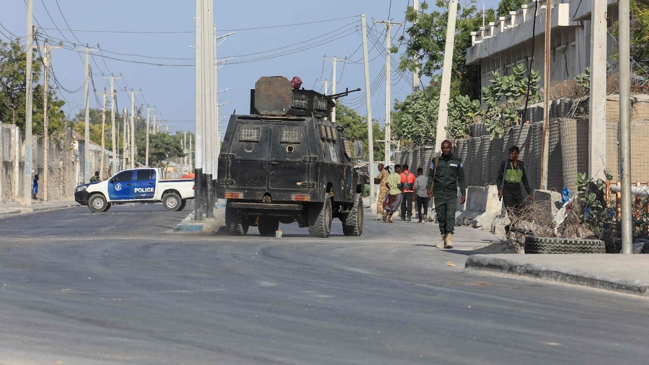 Security forces patrol outside a building which was attacked by suspected Al Shabaab militants in the Somalia's capital Mogadishu. Credit: AFP File Photo