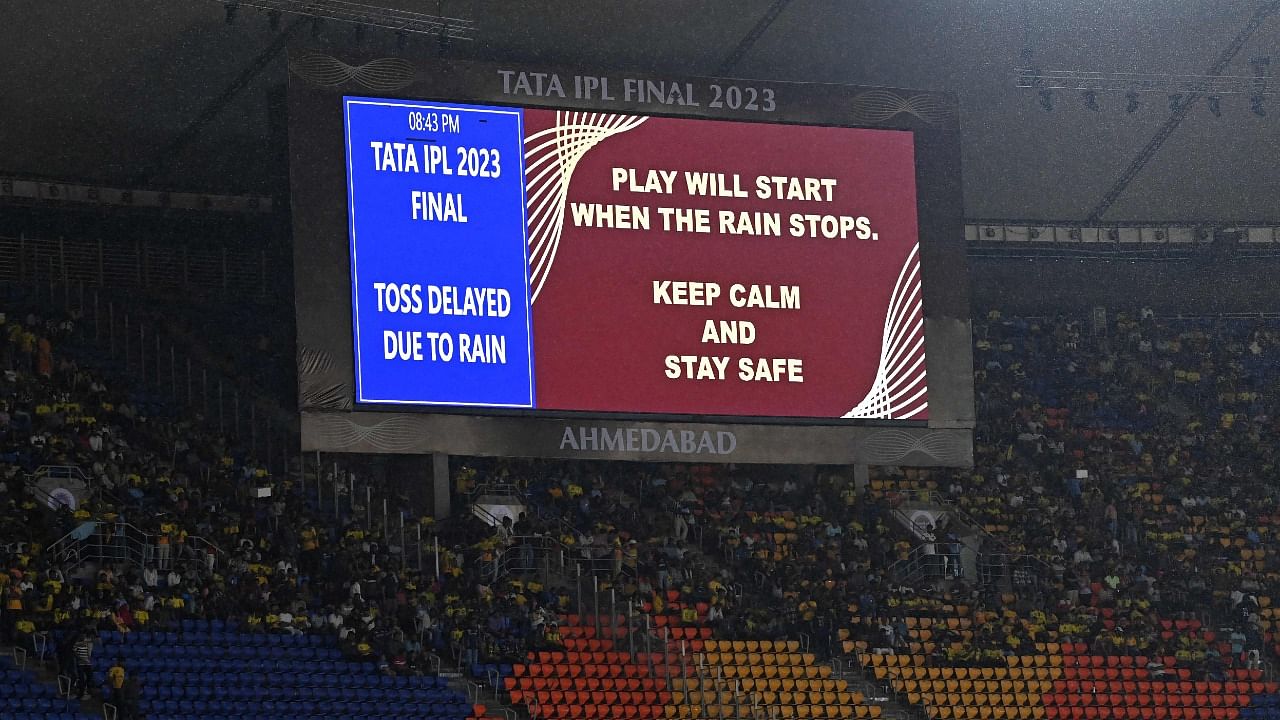 A digital board displays message that toss has been delayed due to rain before the start of the Indian Premier League (IPL) Twenty20 final. Credit: AFP Photo