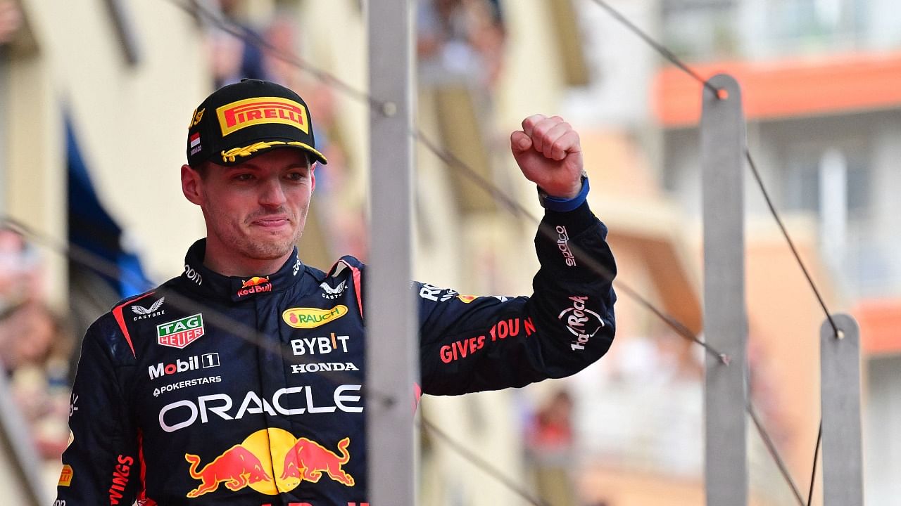 Max Verstappen celebrates on the podium after winning the Formula One Monaco Grand Prix. Credit: AFP Photo