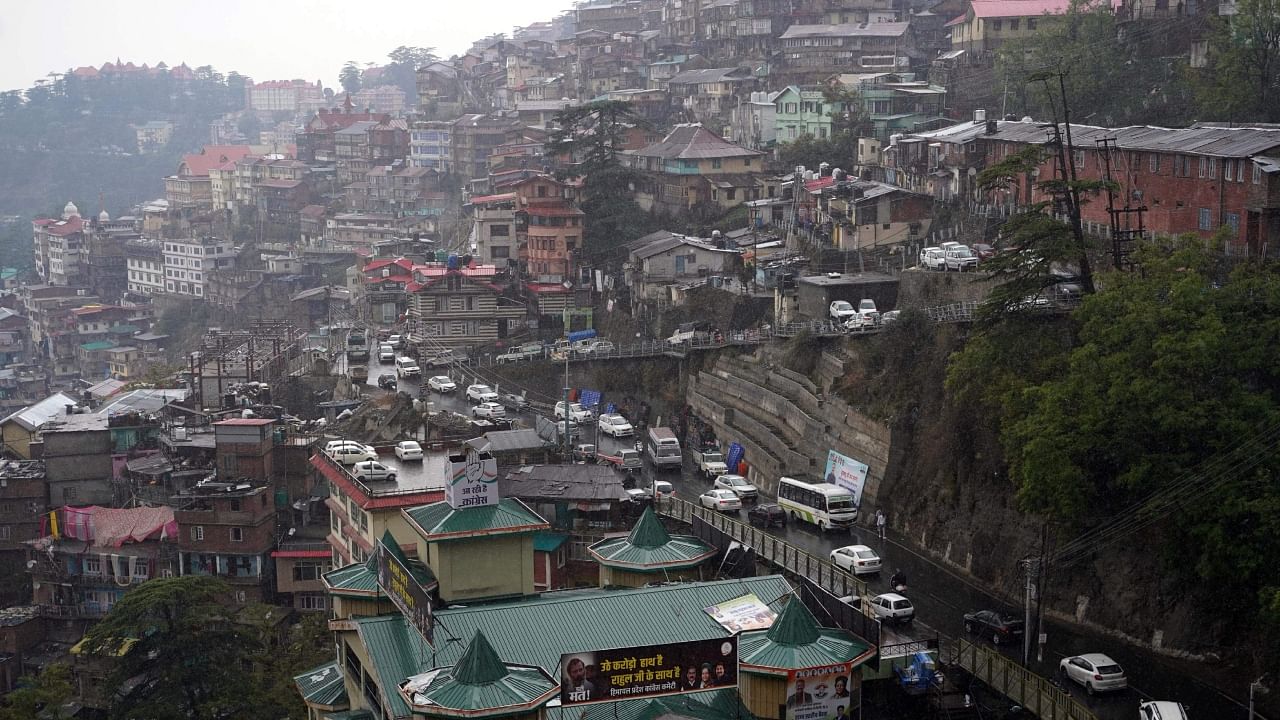 Vehicles ply on the Cart Road, in Shimla, Sunday, April 30, 2023. Credit: PTI Photo