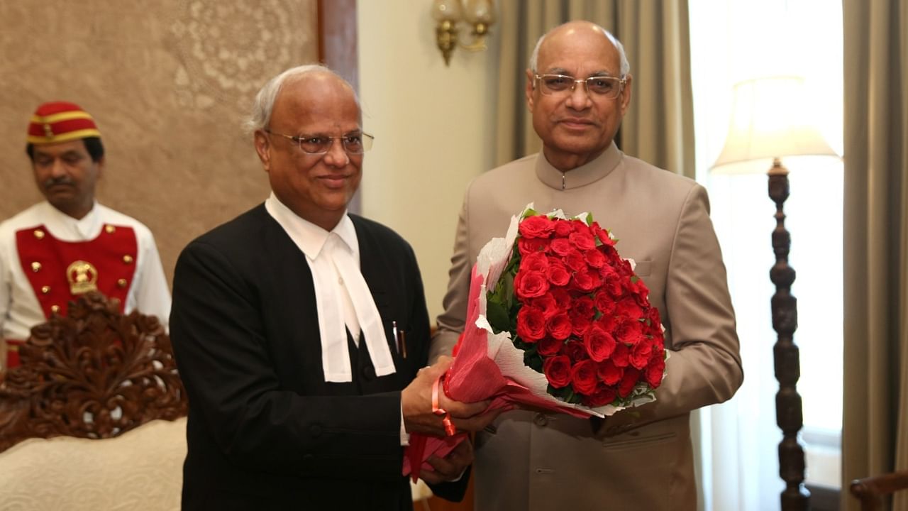 Justice Ramesh Dhanuka (left). Credit: Raj Bhavan