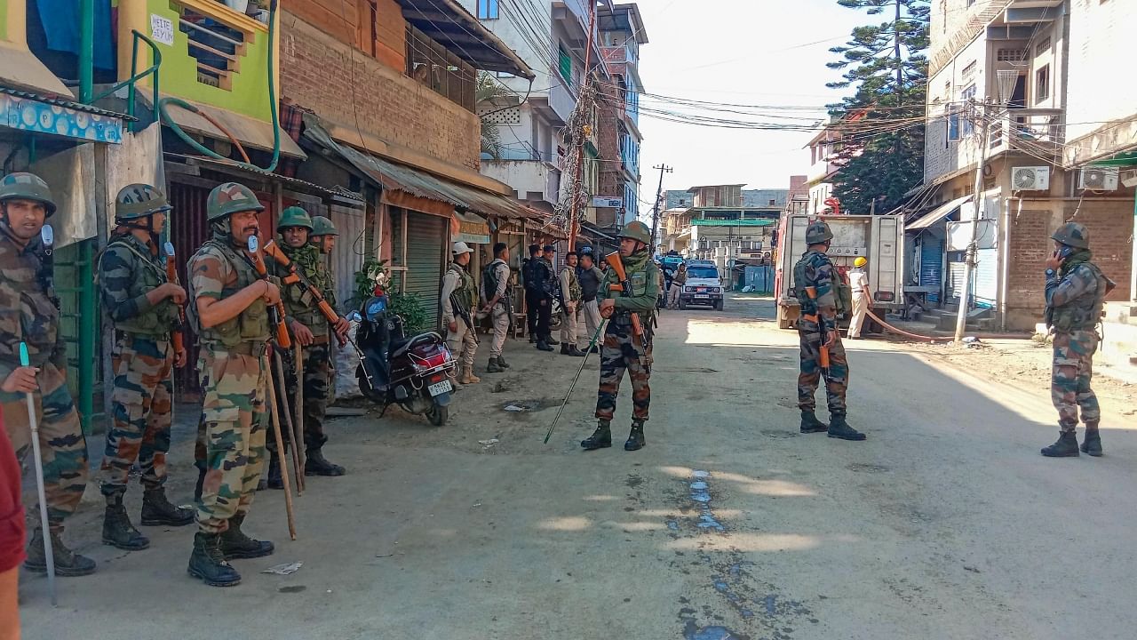 Army jawan stand guard in violence-hit area of Imphal town, Manipur. Credit: PTI Photo