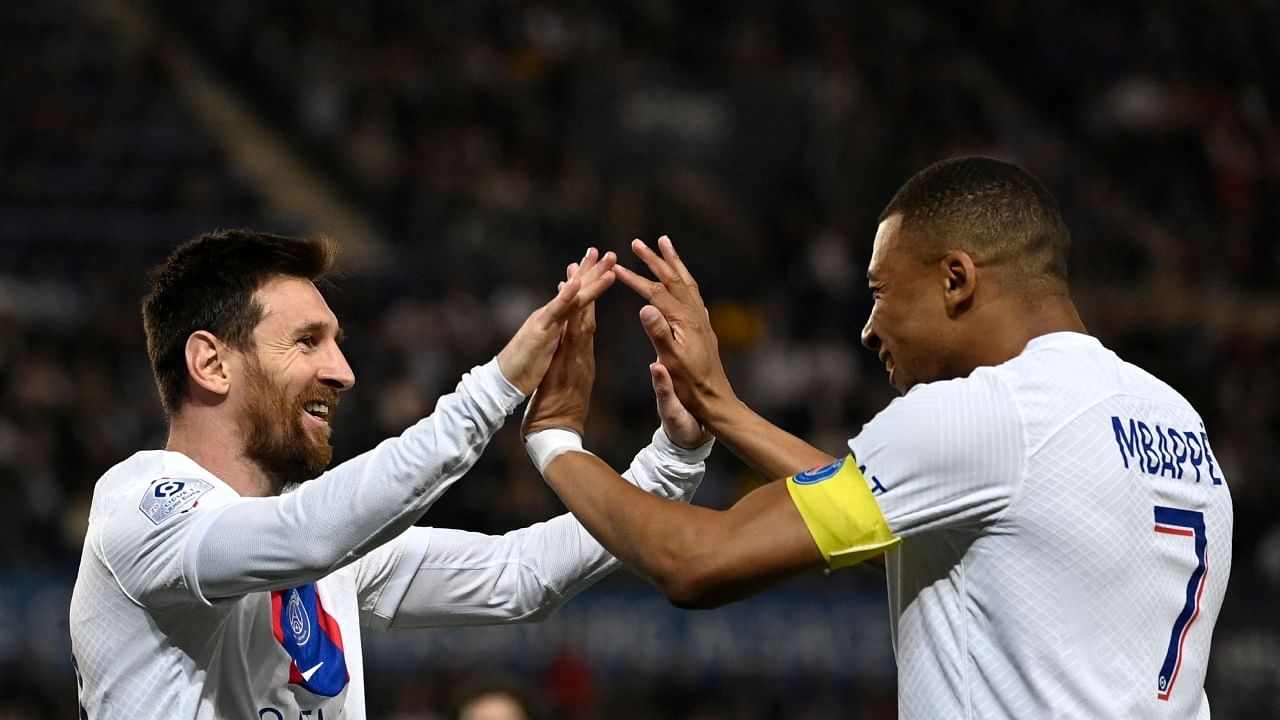 PSG players Lionel Messi (L) and Kylian Mbappe (R) celebrate. Credit: AFP Photo