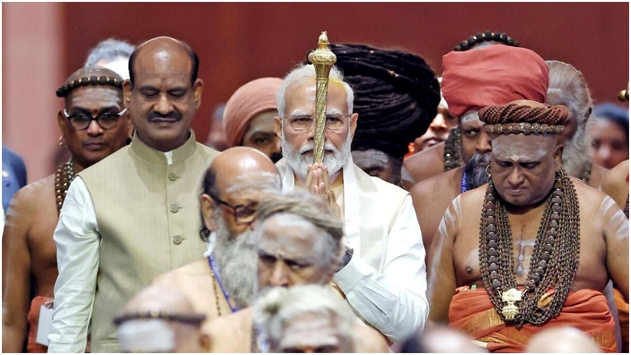 Prime Minister Narendra Modi carries the 'Sengol' in a procession before installing it in the Lok Sabha chamber at the inauguration of the new Parliament building. Credit: IANS Photo