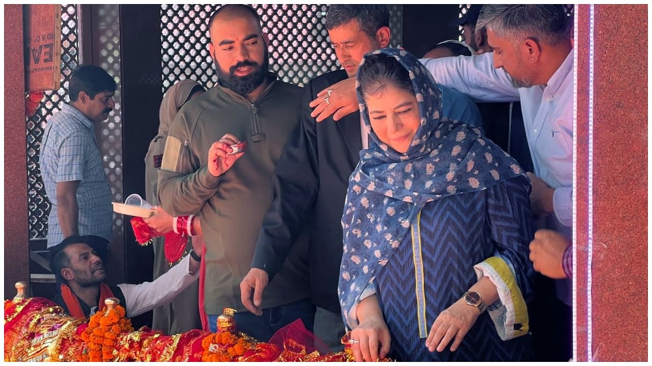 Mehbooba Mufti performs rituals while offering prayers during the annual Kheer Bhawani Mela. Credit: IANS Photo