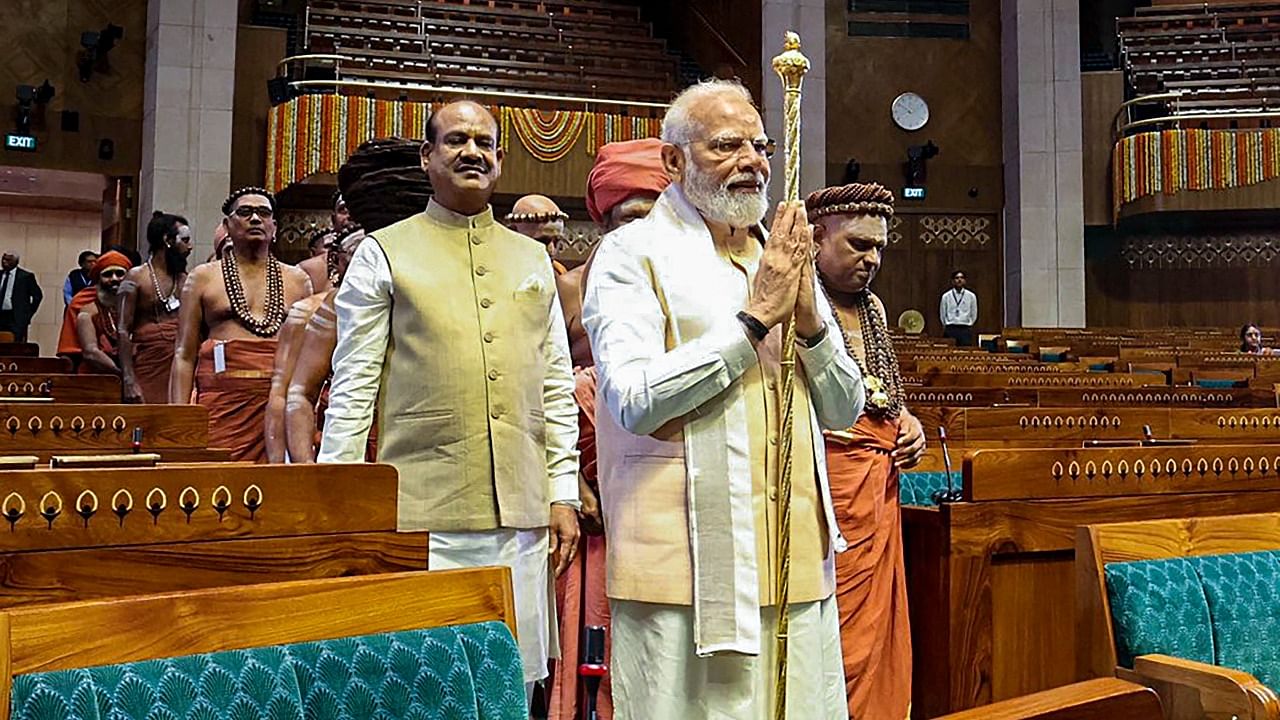 Prime Minister Narendra Modi carries the 'Sengol' in a procession before installing it in the Lok Sabha chamber at the inauguration of the new Parliament building. Credit: PTI Photo